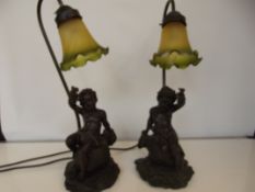 Pair of bronzed resin cherub table lamps
