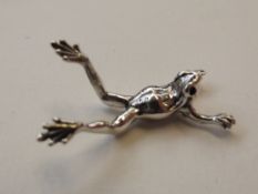 Silver stamped frog figure