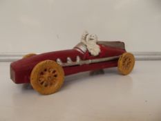 Cast iron Michelin man in racing car