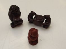 Three carved netsukes