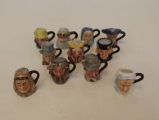 Collection of eleven miniature character jugs, all