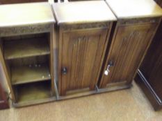 Pair of linen fold oak cabinets together with a co