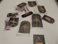Various military ribbons, shoulder titles and insi