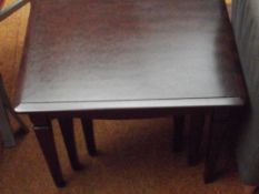 Nest of three mahogany effect tables