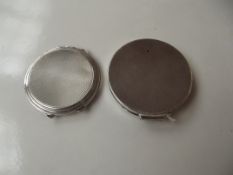 Two silver compacts