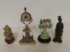 Onyx clock together with two ceramic figures