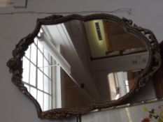 Gilt framed shield shaped mirror
