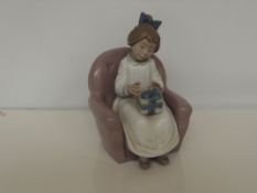 Nao figure of a seated girl, 18 cm