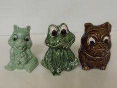Three Sylvac money boxes, dog, beaver and frog