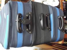 Two Pierre Cardin suitcases and one Dunlop suitcas