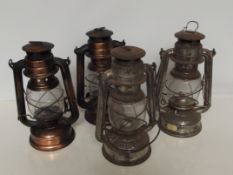 Four Tilley lamps