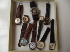 Collection of 9 watches, some with advertising dia