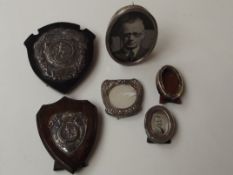 Four silver photograph frames together with a Roya