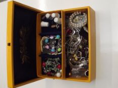 Cantilever jewellery box containing costume jewell