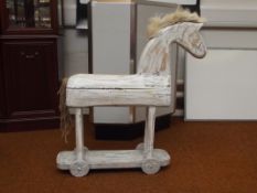 Child's white horse