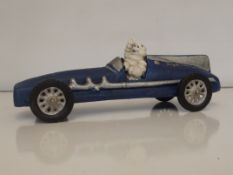 Cast iron Michelin man in racing car