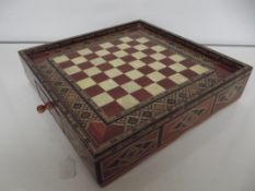 Inlaid chess board with chess pieces