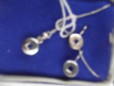 Silver pendant with matching earrings