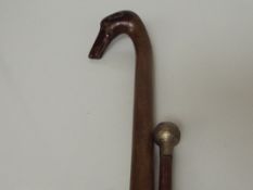 Walking stick in the form of a greyhound together