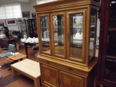 Large light wood display cabinet