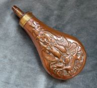 An Antique Copper Powder Flask, decorated with game scene, four position adjustable nozzle.