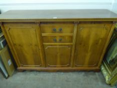 A Light Oak Sideboard, with two short cutlery drawers with cupboard beneath and two cupboards on