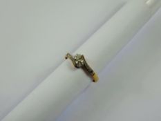 A Lady's 9 ct Diamond Crossover Ring, size O, approx 2.3 gms.