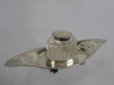 A Solid Silver and Cut Glass Ink Stand, the stand having lion mask design, Chester hallmark, dd 1904