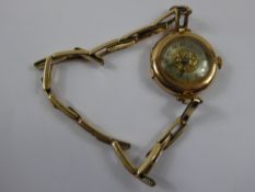 A Lady's 9 ct (375) Cocktail Watch, engine turned face on rolled gold bracelet, 13714 stamp, in