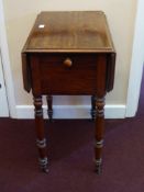 A Victorian Mahogany drop leaf Table