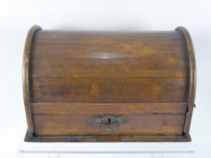 An Antique Roll Top Stationery Box, a drawer and fitted internal compartments, one glass ink bottle,