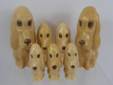Seven Sylvac Porcelain Figures of Spaniels, 3 x 10 cms, 2 x 13 cms and 2 x 19 cms.