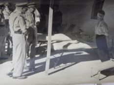 A Collection of Black and White Photographs, depicting wartime propaganda photographs stamped 