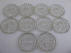 Twelve Glass Coasters, together with a miscellaneous quantity of glass decanter stoppers.