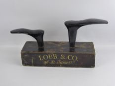 A Lobb of London Advertising Twin Shoe Anvil, black with gold lettering.
