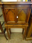 A Teak and Mahogany Knife Display Chest, raised on straight legs, five internal drawers with ivory