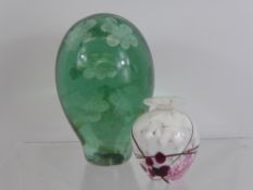 A Victorian Green Glass Dump Weight, approx 15 cms with nine floral inclusions together with a