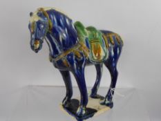 A Blue Glaze Tang Dynasty Style Horse, with character marks to base. (wf)