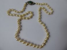 A Set of Lady's Graduated Cultured Pearls, on an Art Deco clasp, approx 54 cms.