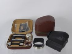 Rolleiflex TLR Cased Camera Pentaprism, Rolleikin 35 (af) and lens hood. (3)