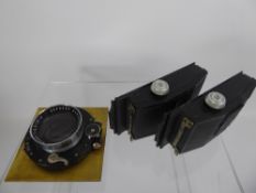 210/4.5 Xenar Lens in shutter, 2 x Roll Film Backs.