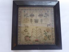 An Antique Sampler Depicting Flowers, Fruit, Trees, a Leopard and a Horse, embroidery reading 