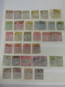 A Crate of Stamps in Album, on page and cover etc; much commonplace but with some better material.