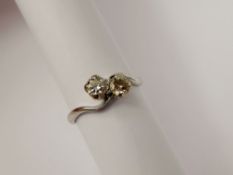 A Lady's 18 ct White Gold and Diamond Cross-Over RIng, size P, 65 pts dias, approx 2.7 gms.