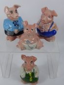 A Collection of Four Porcelain Nat West Pigs, one dressed in blue trousers (approx 17 cms), ( one in