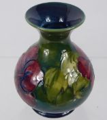 A Moorcroft Vase, Hibiscus pattern, approx 14 cms high.