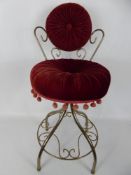 A Velvet Covered Brass Telephone Chair.