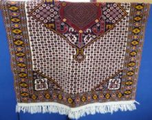 A Middle Eastern Kurdish Woollen Rug, red, white and ochre colouring of geometric design, approx 163