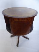 An Oak Drum Book Case, on feet with ball and claw casters.