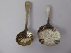 A Georgian Silver Caddy Spoon, Birmingham hallmark, dated 1824 mm Bettridge together with a Georgian
